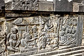 Prambanan - Ramayana reliefs on Shiva Temple. Panels of Scene 9. Dasharatha and Kaikeyi (left) Bharata sits above offerings (centre), Dasharatha's court is seated to the right. 